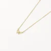 New Medley x Dinnara Micro Bow Necklace in 10k Gold Symbolic Jewellery | Necklaces & Pendants