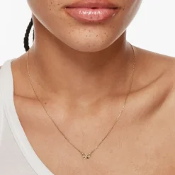 New Medley x Dinnara Micro Bow Necklace in 10k Gold Symbolic Jewellery | Necklaces & Pendants
